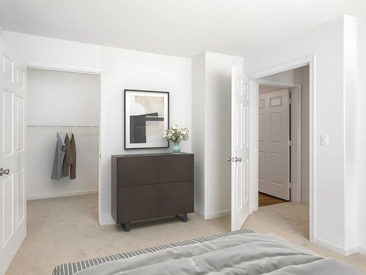 a bedroom with a bed and a dresser and a closet